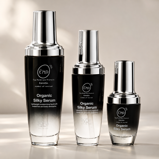Three bottles of Organic Silky Serum with EMP branding on a neutral background